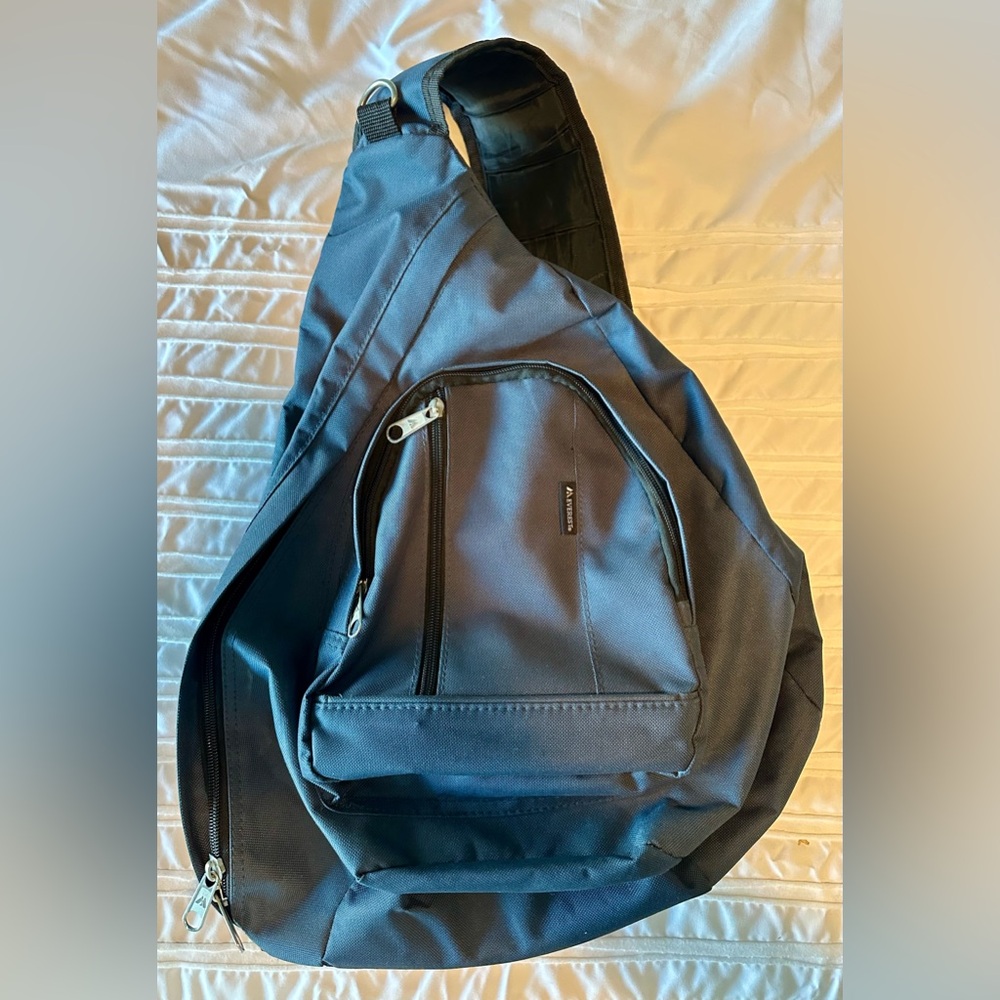 Everest Slingback Crossbody Backpack Dark blue. Lots of zip pockets.